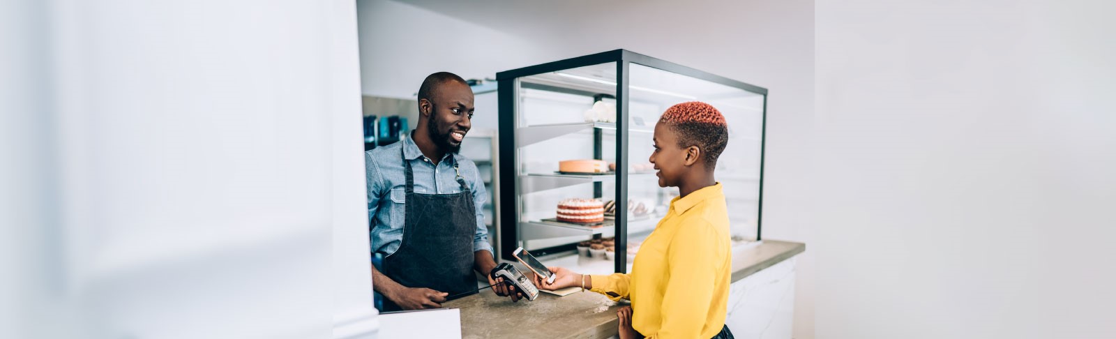 Woman paying at counter